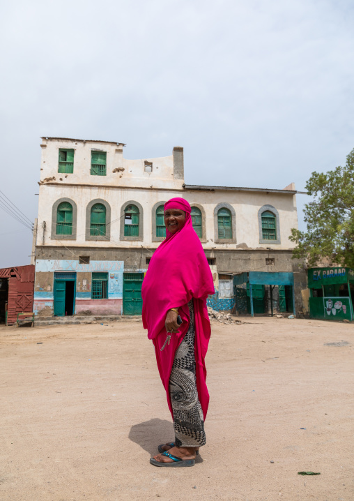 Somali woman in front of old ottoman houses, Sahil region, Berbera, Somaliland
