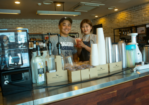 North korean defector joseph park with huaryeong working at yovel cafe in ibk bank, National capital area, Seoul, South korea