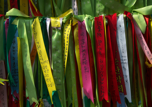 Messages of peace and unity written on ribbons left on fence at dmz, Sudogwon, Paju, South korea