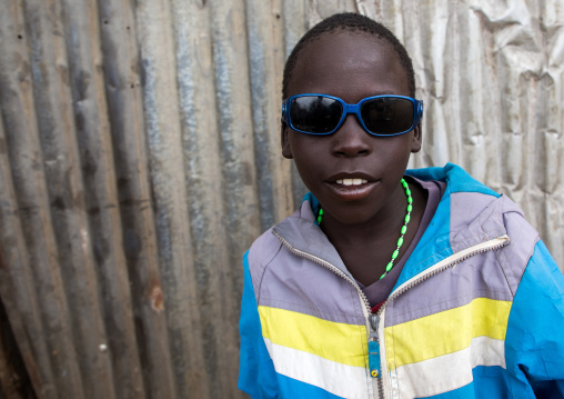 Portrait of a Toposa boy with sunglasses, Namorunyang State, Kapoeta, South Sudan