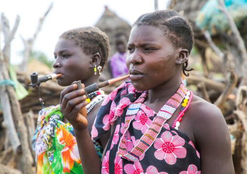 Toposa tribe women smoking pipes, Namorunyang State, Kapoeta, South Sudan