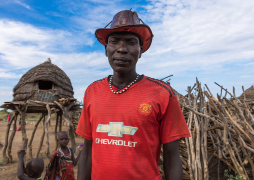Toposa tribe man wearing a Manchester United shirt, Namorunyang State, Kapoeta, South Sudan