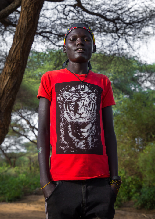 Toposa tribe young man wearing western clothes, Namorunyang State, Kapoeta, South Sudan