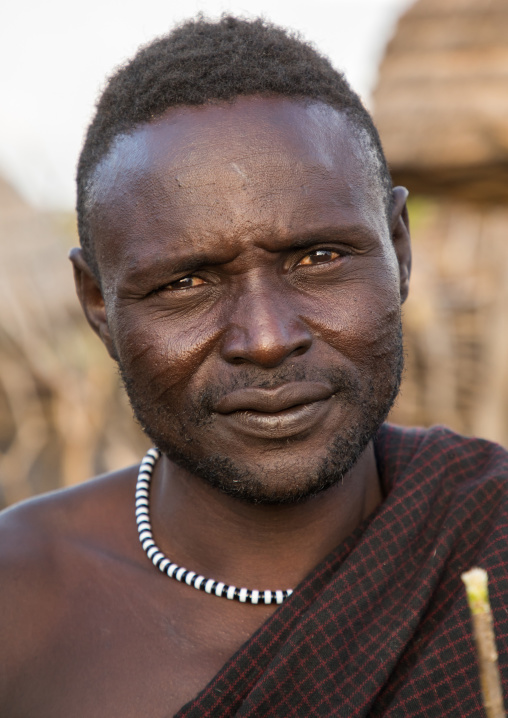 Portrait of a Toposa tribe man with scars on the cheeks, Namorunyang State, Kapoeta, South Sudan