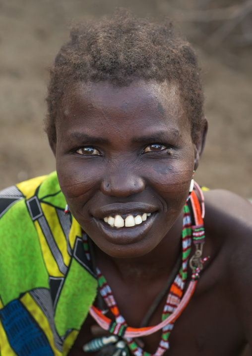Portrait of a smiling Toposa tribe woman, Namorunyang State, Kapoeta, South Sudan