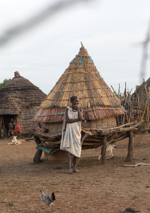 Portrait of a Toposa tribe woman in front of a granary, Namorunyang State, Kapoeta, South Sudan