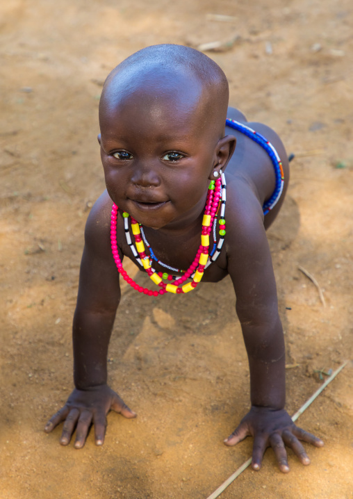 Larim tribe baby girl on all fours
, Boya Mountains, Imatong, South Sudan
