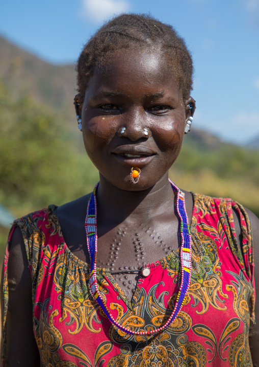 Portrait of a Larim tribe woman with scarifications on her body, Boya Mountains, Imatong, South Sudan