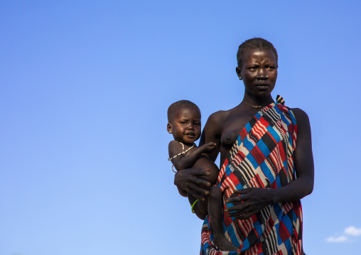 Larim tribe woman carrying her baby, Boya Mountains, Imatong, South Sudan