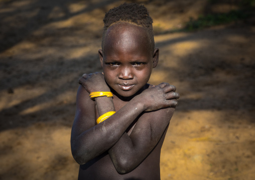 Larim tribe boy with arms crossed, Boya Mountains, Imatong, South Sudan