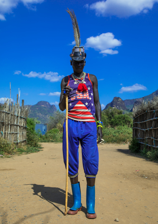 Larim tribe man with american tshirt and a hat, Boya Mountains, Imatong, South Sudan