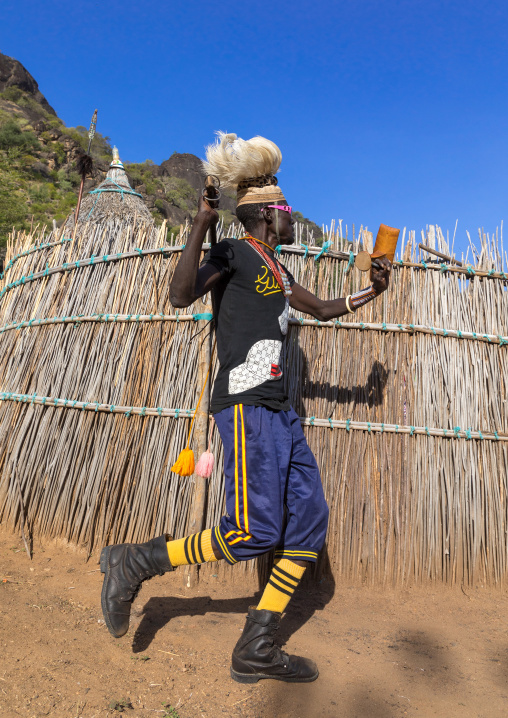Larim tribe man dancing during a wedding ceremony, Boya Mountains, Imatong, South Sudan