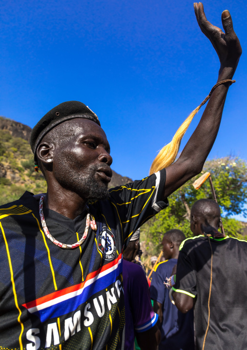 Larim tribe men dancing during a wedding ceremony, Boya Mountains, Imatong, South Sudan