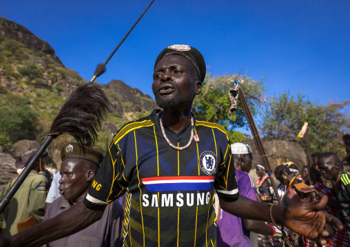 Larim tribe men dancing during a wedding ceremony, Boya Mountains, Imatong, South Sudan