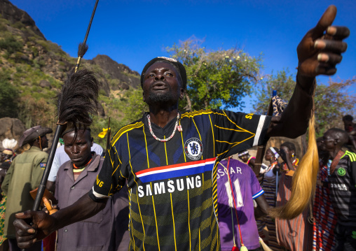 Larim tribe men dancing during a wedding ceremony, Boya Mountains, Imatong, South Sudan