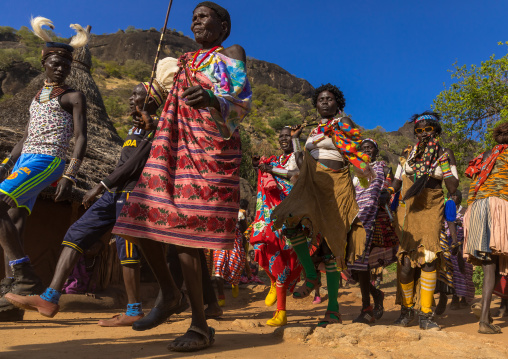 Larim tribe women and men dancing during a wedding celebration, Boya Mountains, Imatong, South Sudan