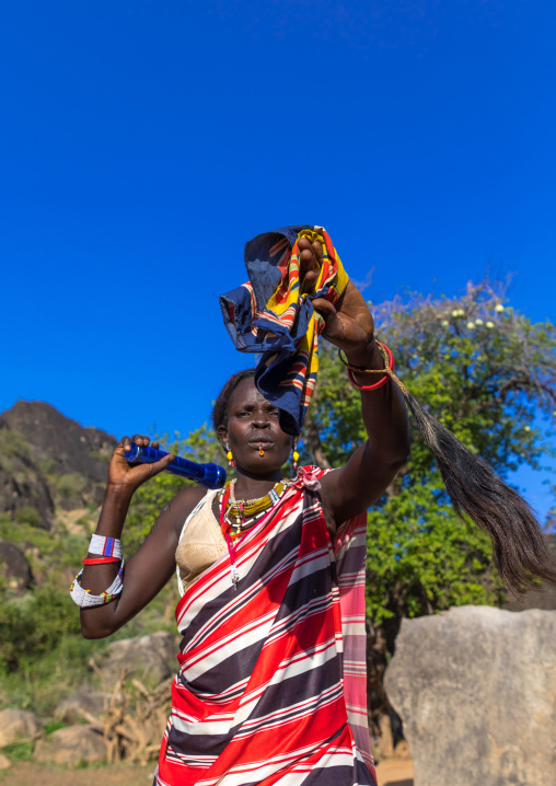 Larim tribe woman dancing during a wedding celebration, Boya Mountains, Imatong, South Sudan