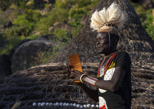 Larim tribe man with a wooden seat during a wedding ceremony, Boya Mountains, Imatong, South Sudan