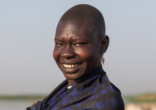 Portrait of a smiling Mundari tribe woman, Central Equatoria, Terekeka, South Sudan