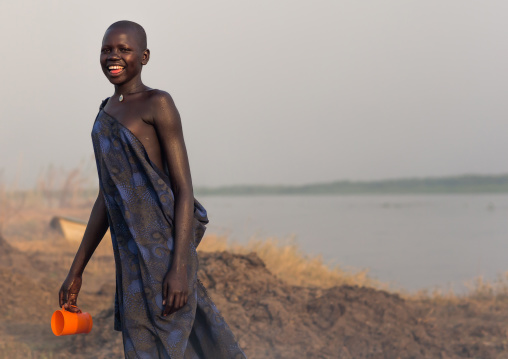Portrait of a Mundari tribe woman in front of the river Nile, Central Equatoria, Terekeka, South Sudan