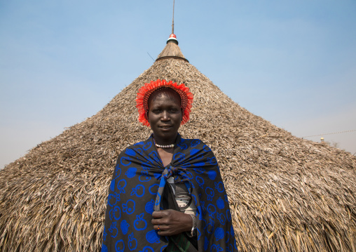 Portrait of a Mundari tribe woman in front of her hut, Central Equatoria, Terekeka, South Sudan