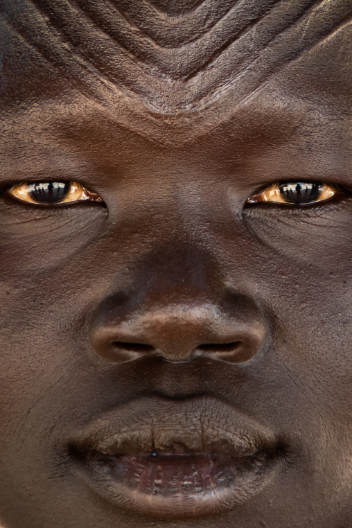 Close-up of a Mundari tribe woman with scarifications on the forehead, Central Equatoria, Terekeka, South Sudan