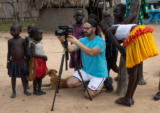 Tourist taking pictures in Mundari tribe, Central Equatoria, Terekeka, South Sudan