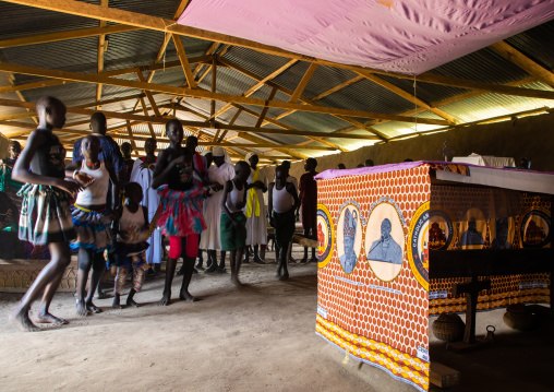 Mundari tribe people dancing and singing during a sunday mass in a church, Central Equatoria, Terekeka, South Sudan