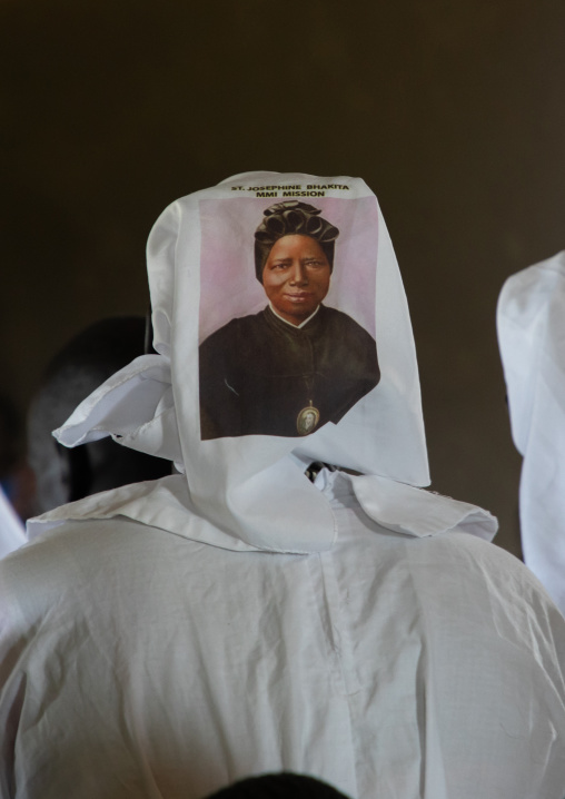Mundari nin with a bhakita picture on her headscarf attending a sunday mass in a church, Central Equatoria, Terekeka, South Sudan