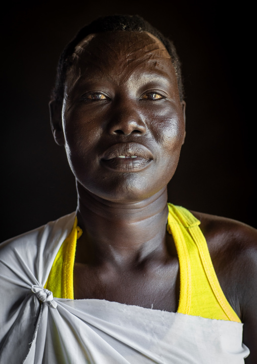 Portrait of a Mundari tribe woman with scarifications on the forehead, Central Equatoria, Terekeka, South Sudan