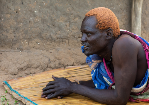 Portrait of a Mundari tribe man with hair dyed in orange with cow urine, Central Equatoria, Terekeka, South Sudan