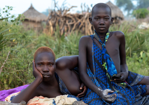 Portrait of a Mundari tribe women resting on a bed, Central Equatoria, Terekeka, South Sudan