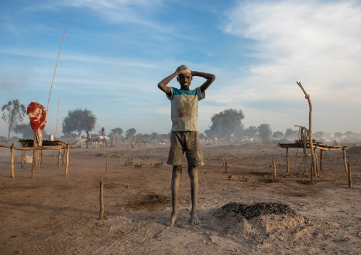 Mundari tribe boy covering his face in ash to protect from the mosquitoes and flies bites, Central Equatoria, Terekeka, South Sudan