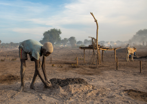 Mundari tribe boy covering his face in ash to protect from the mosquitoes and flies bites, Central Equatoria, Terekeka, South Sudan