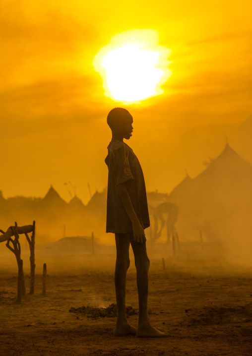 Mundari tribe boy standing in the sunset, Central Equatoria, Terekeka, South Sudan