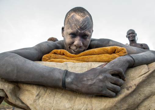 Portrait of a Mundari tribe man resting on his bed in the camp, Central Equatoria, Terekeka, South Sudan
