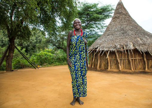 Smiling Larim tribe woman in front of her traditional house, Boya Mountains, Imatong, South Sudan