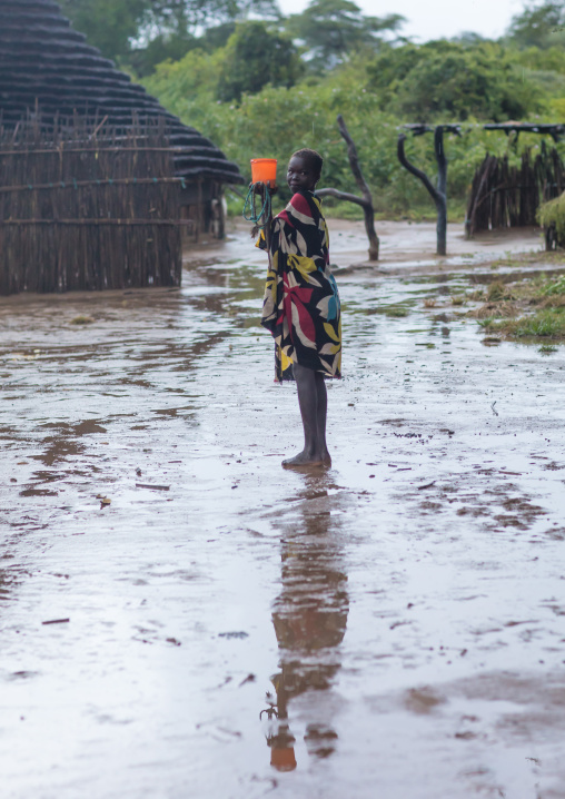 Larim tribe girl under the rain in a village, Boya Mountains, Imatong, South Sudan