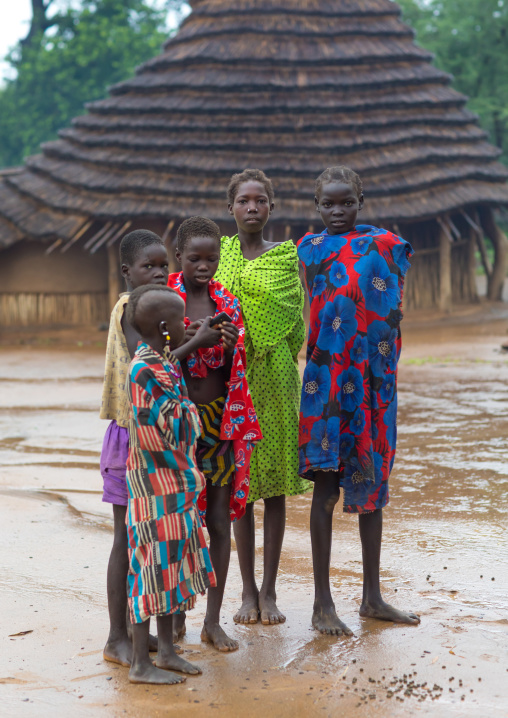 Larim tribe girls under the rain in a village, Boya Mountains, Imatong, South Sudan
