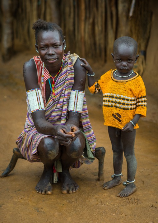 Larim tribe mother with arm necklaces with her son, Boya Mountains, Imatong, South Sudan