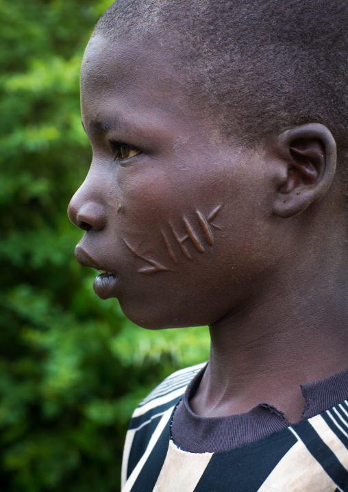 Larim tribe boy with scarifications on the cheek, Boya Mountains, Imatong, South Sudan