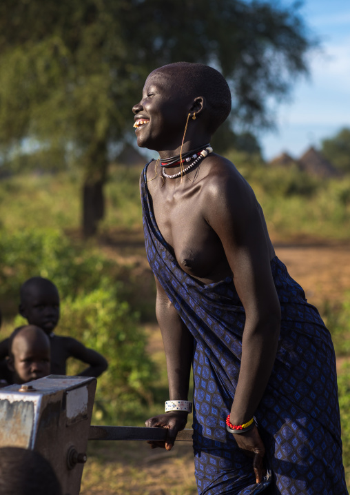 Mundari tribe woman pumping water in a well, Central Equatoria, Terekeka, South Sudan