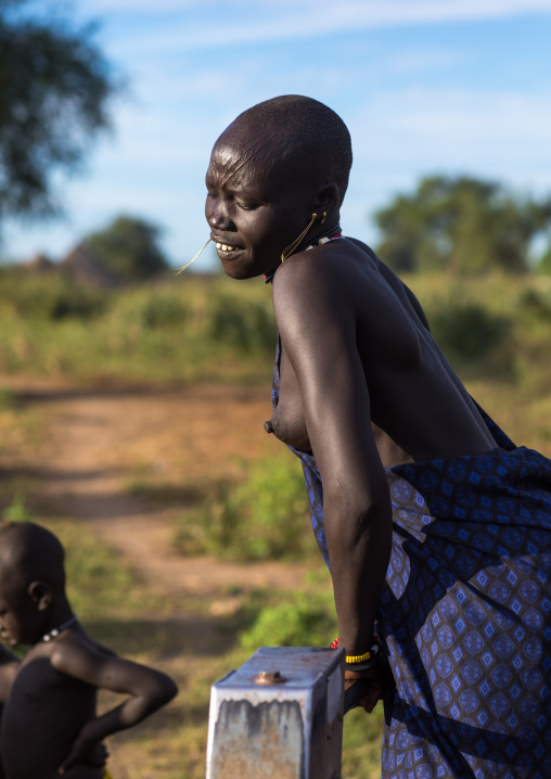 Mundari tribe woman pumping water in a well, Central Equatoria, Terekeka, South Sudan