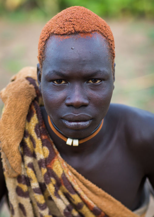 Portrait of a Mundari tribe man with hair dyed in orange with cow urine, Central Equatoria, Terekeka, South Sudan