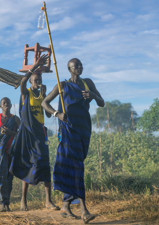 Mundari tribe women marching in line while celebrating a wedding, Central Equatoria, Terekeka, South Sudan