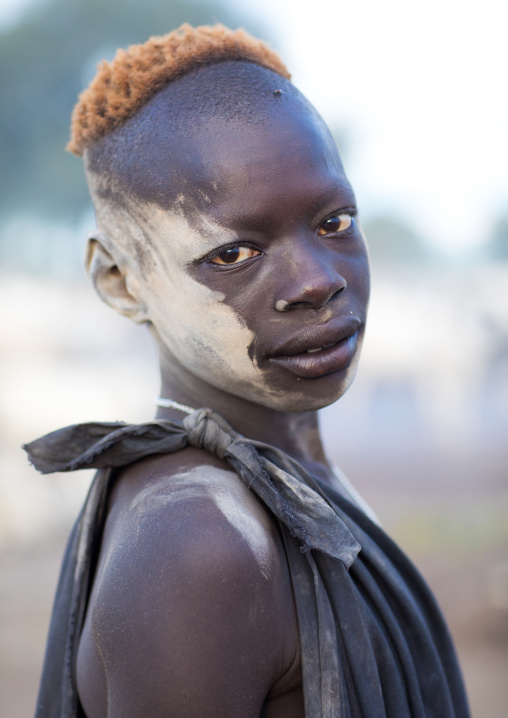 Mundari tribe boy covered in ash to protect from the mosquitoes and flies, Central Equatoria, Terekeka, South Sudan