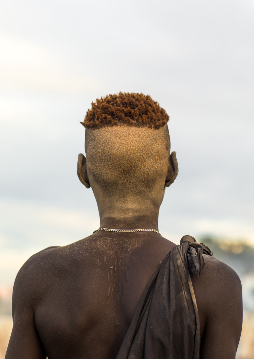 Mundari tribe boy covered in ash to protect from the mosquitoes and flies, Central Equatoria, Terekeka, South Sudan