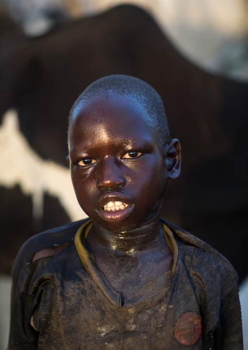 Mundari tribe boy after showering in the cow urine to dye his hair in orange, Central Equatoria, Terekeka, South Sudan
