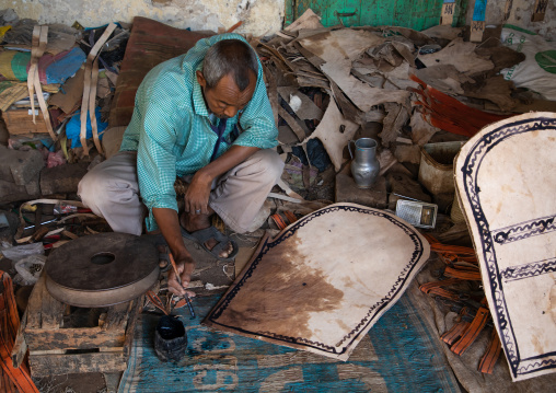 Sudanese man working on leather in the market, Kassala State, Kassala, Sudan