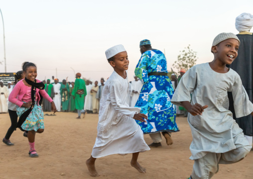 Children running during the friday sufi celebration at sheikh Hamad el nil tomb, Khartoum State, Omdurman, Sudan
